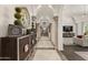 Grand hallway with arched ceiling, pillars, decorative furniture and hardwood flooring at 7475 E Gainey Ranch Rd # 22, Scottsdale, AZ 85258