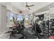 Well-equipped home gym with multiple exercise machines and mirrored wall overlooking the golf course at 7475 E Gainey Ranch Rd # 22, Scottsdale, AZ 85258