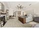 Large main bedroom boasts a fireplace, sitting area, elegant decor, and lots of natural light at 7475 E Gainey Ranch Rd # 22, Scottsdale, AZ 85258