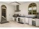 Well-equipped outdoor kitchen with stainless steel appliances, including a grill, sink, and refrigerator at 7475 E Gainey Ranch Rd # 22, Scottsdale, AZ 85258