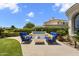 Stylish outdoor lounge area with comfortable seating, a modern fire pit, and manicured landscaping at 7475 E Gainey Ranch Rd # 22, Scottsdale, AZ 85258