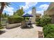 Elegant outdoor dining area with a large table, comfortable seating, and a shade umbrella at 7475 E Gainey Ranch Rd # 22, Scottsdale, AZ 85258