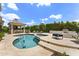 Backyard pool with a spa and a built-in outdoor kitchen at 7475 E Gainey Ranch Rd # 22, Scottsdale, AZ 85258