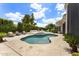 Backyard pool with a spa, patio furniture and a tiled deck at 7475 E Gainey Ranch Rd # 22, Scottsdale, AZ 85258