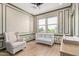 Bright Bedroom with crib, comfortable seating, and views of neighborhood at 820 N 8Th Ave # 14, Phoenix, AZ 85007