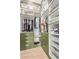 Custom closet with olive-green cabinetry, gold hardware, ample shelving, and organized storage for clothes and personal items at 820 N 8Th Ave # 14, Phoenix, AZ 85007
