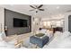 Comfortable living area featuring a large TV, plush seating, and stylish decor at 820 N 8Th Ave # 14, Phoenix, AZ 85007