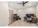 Spacious office area with two desks, chairs, ceiling fan, and stainless steel refrigerator at 820 N 8Th Ave # 14, Phoenix, AZ 85007