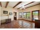 Spacious bedroom with wood beam ceiling, tile floors and a view of the landscape at 9030 E Trail Dr, Carefree, AZ 85377