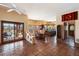 Open dining area next to the kitchen with Saltillo tile floors, and access to the pool area at 9030 E Trail Dr, Carefree, AZ 85377