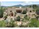 Attractive Southwestern-style home with desert landscaping, private courtyard, and mountain views at 9030 E Trail Dr, Carefree, AZ 85377