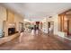 An expansive living room featuring Saltillo tile, fireplace, and rustic columns at 9030 E Trail Dr, Carefree, AZ 85377