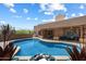 Stunning pool featuring rock accents, lounge seating, and beautiful desert surroundings at 9030 E Trail Dr, Carefree, AZ 85377