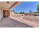 Spacious, low-maintenance backyard featuring an extended patio and unique landscaping at 925 W San Marcos Dr, Chandler, AZ 85225