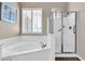 Relaxing bathroom with a soaking tub, glass-enclosed shower, and neutral tones to create a peaceful ambiance at 925 W San Marcos Dr, Chandler, AZ 85225
