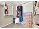 Well-organized closet featuring shelving, hanging rods, and a dresser for all your storage needs at 925 W San Marcos Dr, Chandler, AZ 85225