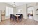 Spacious dining area with wood floors, a modern light fixture, and comfortable seating at 925 W San Marcos Dr, Chandler, AZ 85225