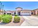 Charming single-story home with a well-manicured front yard, a two-car garage, and a tile roof at 925 W San Marcos Dr, Chandler, AZ 85225