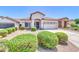 Lovely one-story home with an attached garage and attractive landscaping, including well-maintained shrubs and gravel at 925 W San Marcos Dr, Chandler, AZ 85225