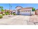 Attractive home with a well-maintained lawn, a driveway, and a tan exterior, perfect for curb appeal at 925 W San Marcos Dr, Chandler, AZ 85225