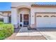 Close-up of the front entrance with a decorative screen door, tidy landscaping, and a welcoming feel at 925 W San Marcos Dr, Chandler, AZ 85225