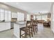 Kitchen featuring island seating, tile floors, and white cabinets, perfect for entertaining guests at 925 W San Marcos Dr, Chandler, AZ 85225