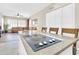 Close-up view of the kitchen island cooktop, seating and the living room beyond at 925 W San Marcos Dr, Chandler, AZ 85225