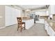 Spacious kitchen with tile flooring, white cabinets, and stainless steel appliances at 925 W San Marcos Dr, Chandler, AZ 85225
