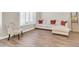 Comfortable sitting area featuring light-colored walls, wood floors, and an inviting sectional sofa at 925 W San Marcos Dr, Chandler, AZ 85225