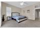 Main bedroom with neutral carpet, plantation shutters and ensuite bathroom at 925 W San Marcos Dr, Chandler, AZ 85225
