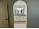 Bathroom with double vanity, granite countertops, and white cabinets at 10101 N 91St Ave # 88, Peoria, AZ 85345