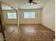Spacious bedroom features light-filled windows and a mirror sliding door closet at 10101 N 91St Ave # 88, Peoria, AZ 85345