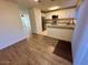 Open kitchen features white cabinets, stainless steel appliances, and granite countertops at 10101 N 91St Ave # 88, Peoria, AZ 85345