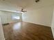 Bright living room with ceiling fan, natural light, and stylish wood-look flooring at 10101 N 91St Ave # 88, Peoria, AZ 85345
