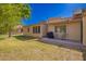Image of the backyard showing the lawn, trees, and patio at 1021 S Greenfield Rd # 1165, Mesa, AZ 85206