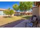 Backyard view features mature landscaping and a patio area at 1021 S Greenfield Rd # 1165, Mesa, AZ 85206