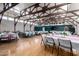 Large banquet hall featuring tables set up for an event, with an accent wall and large-screen television at the far end at 1021 S Greenfield Rd # 1165, Mesa, AZ 85206