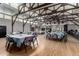 Spacious banquet hall featuring soaring ceilings with exposed beams, hardwood floors, and abundant natural light from large windows at 1021 S Greenfield Rd # 1165, Mesa, AZ 85206