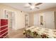 Bedroom featuring a mirrored closet door and an ensuite bathroom with grab bars for accessibility at 1021 S Greenfield Rd # 1165, Mesa, AZ 85206