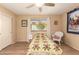 Relaxing bedroom with a comfortable bed, ceiling fan, and view of the outdoors through the window at 1021 S Greenfield Rd # 1165, Mesa, AZ 85206