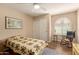 A neutral bedroom with a quilt bedspread, sliding door closet, and rocking chair at 1021 S Greenfield Rd # 1165, Mesa, AZ 85206