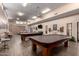 Billiard room with billiard tables and ample seating and decor at 1021 S Greenfield Rd # 1165, Mesa, AZ 85206