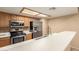 A kitchen with stainless steel appliances and tile backsplash at 1021 S Greenfield Rd # 1165, Mesa, AZ 85206