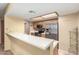 A kitchen with stainless steel appliances and a breakfast bar at 1021 S Greenfield Rd # 1165, Mesa, AZ 85206
