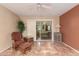 Bright sunroom offering a view of another living space with comfortable seating and natural light at 1021 S Greenfield Rd # 1165, Mesa, AZ 85206