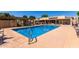 Enjoy this outdoor swimming pool with lounge chairs for relaxation and poolside fun at 1021 S Greenfield Rd # 1165, Mesa, AZ 85206