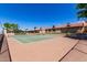 Active community featuring a pristine tennis court with manicured landscaping and sunny skies at 1021 S Greenfield Rd # 1165, Mesa, AZ 85206