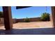 Spacious backyard framed by a covered patio, offering room for outdoor activities at 10335 W Pima St, Tolleson, AZ 85353
