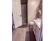Bright bathroom featuring a toilet and vanity with granite countertop, providing a clean and functional space at 10335 W Pima St, Tolleson, AZ 85353