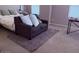 Cozy bedroom with loveseat and carpet, creating a warm and inviting atmosphere for relaxation at 10335 W Pima St, Tolleson, AZ 85353